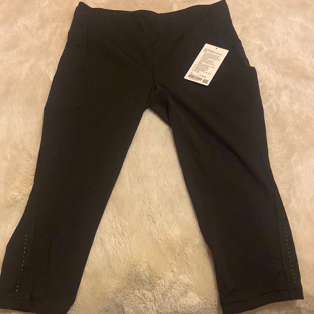 Lululemon, Black Tights swift speed HR crop 21” size 14